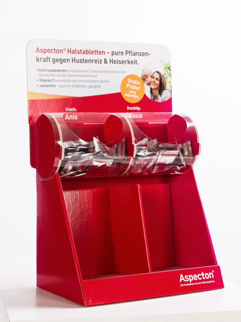 Beispiel für ein Thekendisplay mit zwei Entnahmefächern für Probierpackungen des beworbenen Produkts.