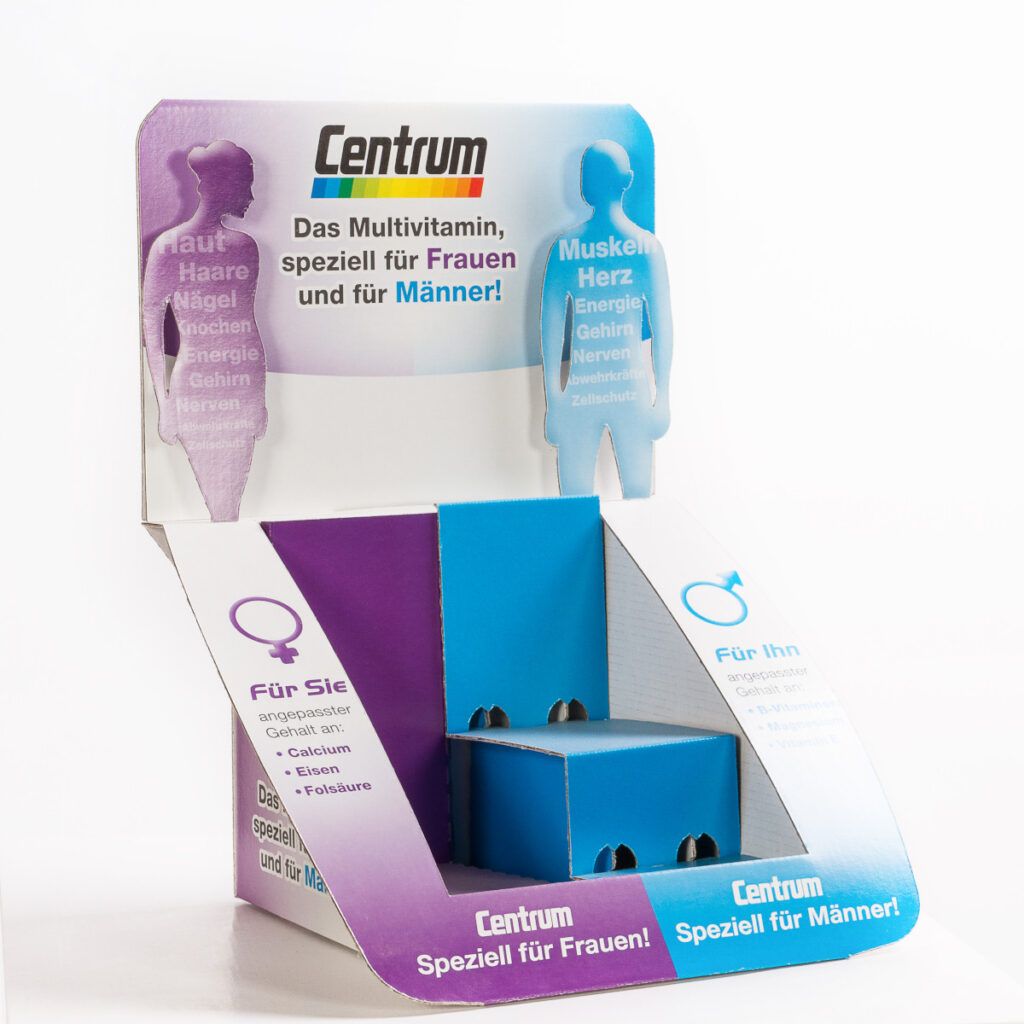 Beispiel für ein Thekendisplay, bestehend aus einer bedruckten Rückwand und einem mehrstufigen Sockel, auf dem das Produkt präsentiert werden kann.