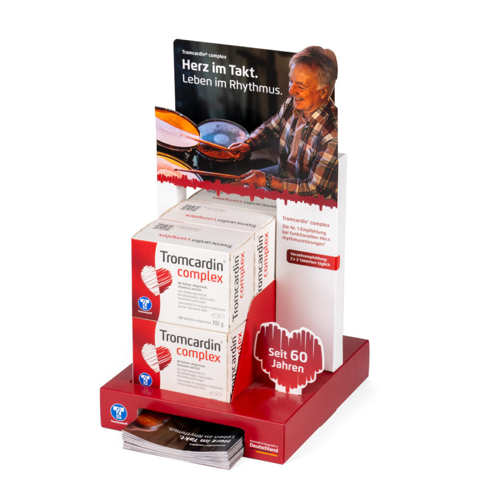 Beispiel für ein Thekendisplay mit verschiedenen Fächern für das Produkt sowie Flyer.