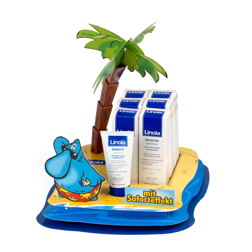 Beispiel für ein Thekendisplay in Form einer kleinen Insel mit nachgebildeter Palme.